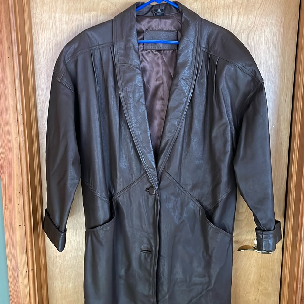 Women’s long brown leather coat.